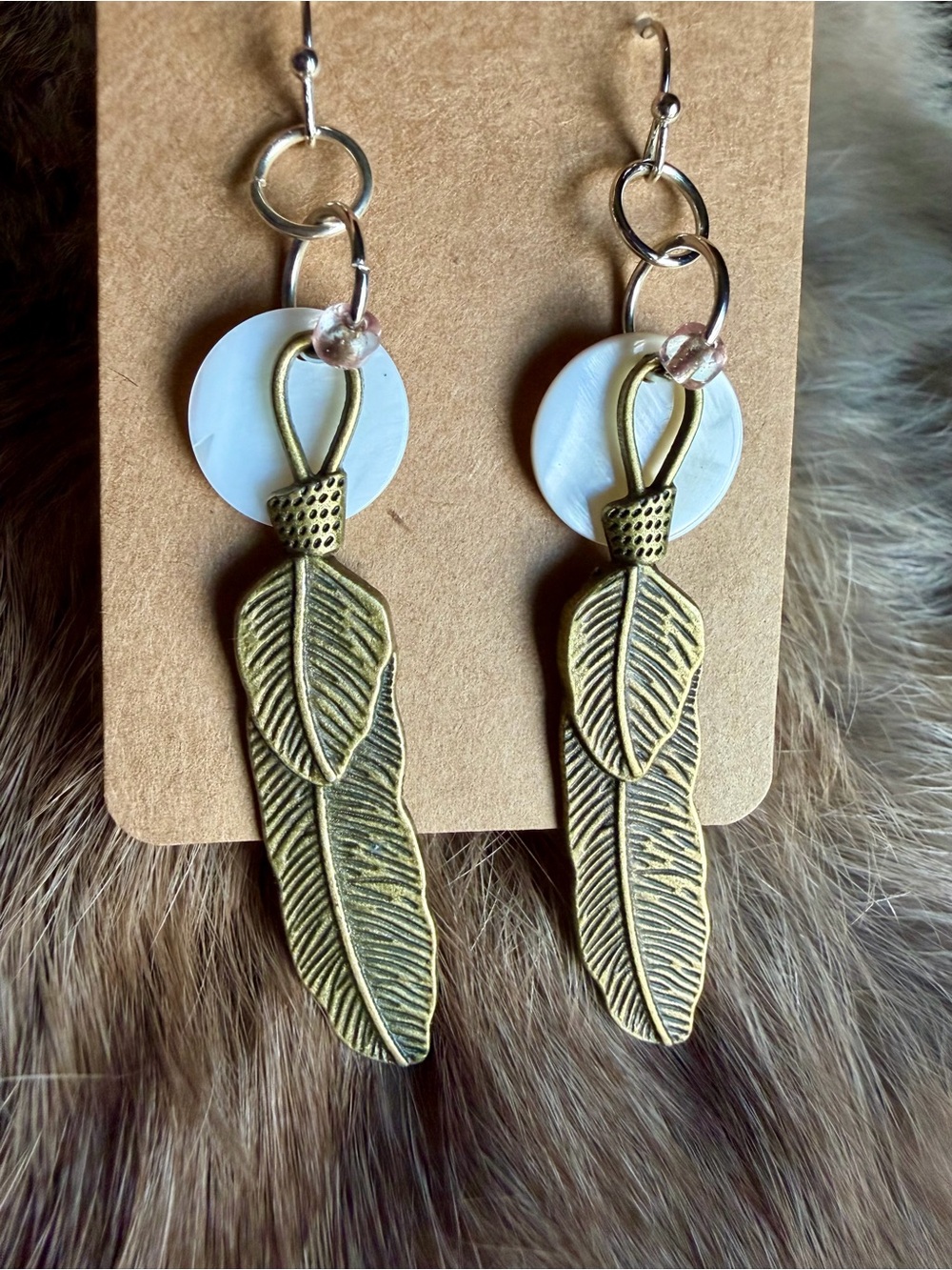 Antique Gold Tone Feather Drop Earrings with Mother Of Pearl Accents